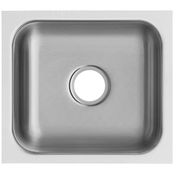 A close-up of a stainless steel undermount sink with a hole in the center.