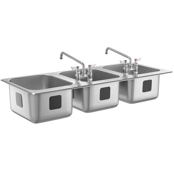 A stainless steel Waterloo three compartment sink with two faucets.
