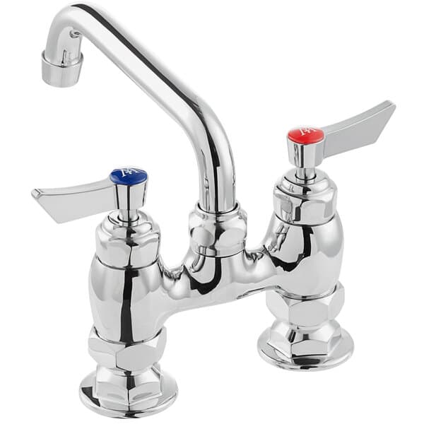 a silver faucet with red knobs