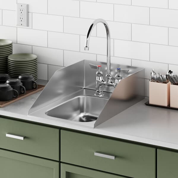 A Waterloo stainless steel drop-in sink with side splashes on a green counter.
