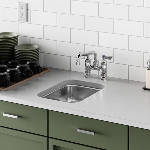 A close up of a Waterloo stainless steel undermount sink.