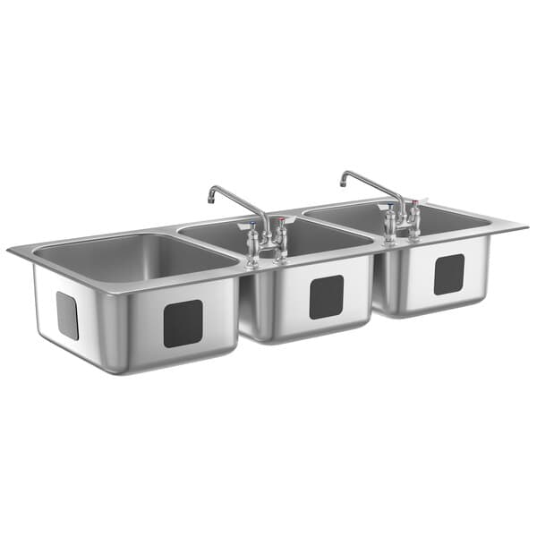 A row of three stainless steel drop-in sink bowls.