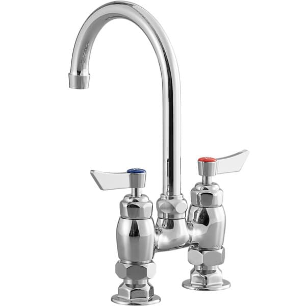 a silver faucet with red knobs